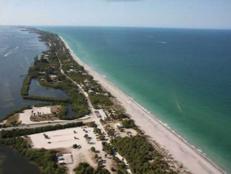 Aerial view of Manasota Beach Park on Manasota Key, with the Gulf shoreline and park parking lot